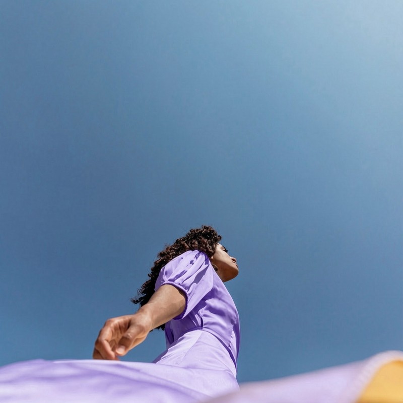 Woman in a lilac outfit celebrating