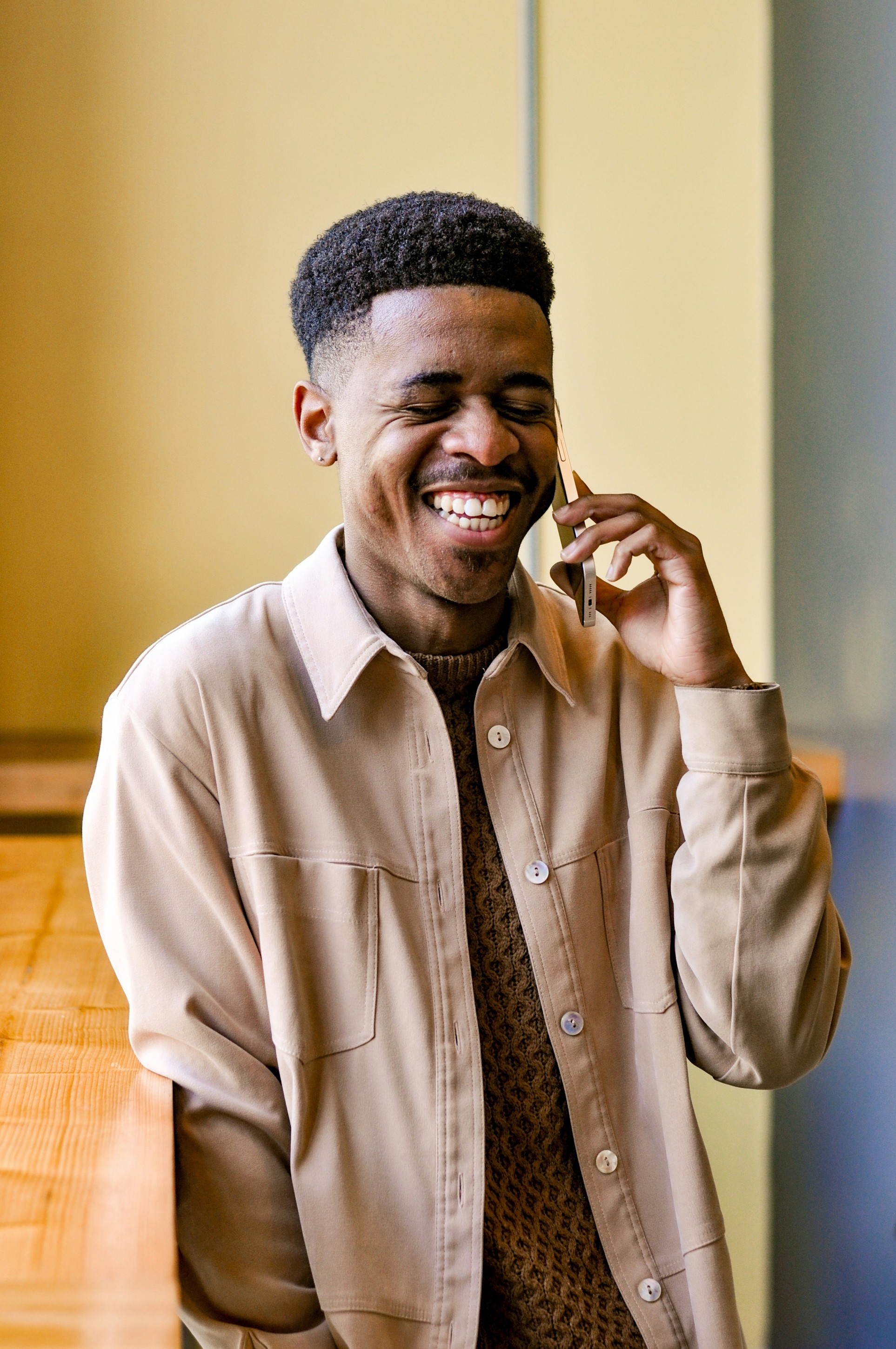 Smiling man on a phone call