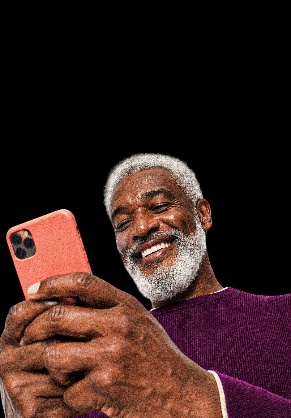 Smiling older man using his phone