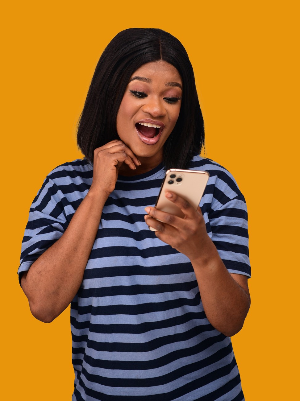 Excited woman looking at her phone